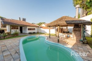 Casa à venda com 268m², 3 dormitórios, 1 suíte, 3 vagas, no bairro Jardim Isabel em Porto Alegre