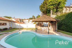 Casa à venda com 268m², 3 dormitórios, 1 suíte, 3 vagas, no bairro Jardim Isabel em Porto Alegre