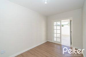 Casa em Condomínio à venda com 221m², 4 dormitórios, 1 suíte, 2 vagas, no bairro Jardim Isabel em Porto Alegre