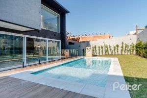 Casa em Condomínio à venda com 289m², 4 dormitórios, 4 suítes, 2 vagas, no bairro Alphaville em PORTO ALEGRE