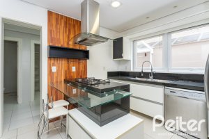 Casa em Condomínio à venda com 463m², 4 dormitórios, 4 suítes, 3 vagas, no bairro Terra Ville em PORTO ALEGRE