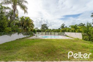 Casa em Condomínio à venda com 463m², 4 dormitórios, 4 suítes, 3 vagas, no bairro Terra Ville em PORTO ALEGRE