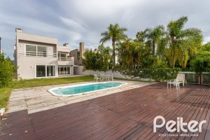 Casa em Condomínio à venda com 463m², 4 dormitórios, 4 suítes, 3 vagas, no bairro Terra Ville em PORTO ALEGRE