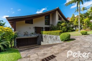 Casa em Condomínio à venda com 565m², 5 dormitórios, 3 suítes, 4 vagas, no bairro Cavalhada em Porto Alegre