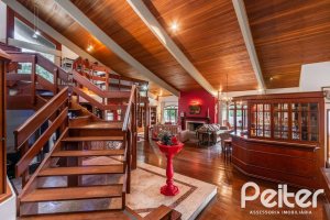 Casa em Condomínio à venda com 565m², 5 dormitórios, 3 suítes, 4 vagas, no bairro Cavalhada em Porto Alegre