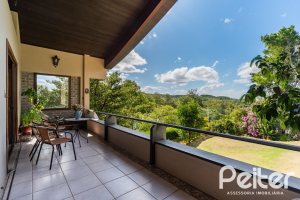 Casa em Condomínio à venda com 565m², 5 dormitórios, 3 suítes, 4 vagas, no bairro Cavalhada em Porto Alegre