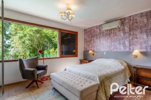 Casa em Condomínio à venda com 565m², 5 dormitórios, 3 suítes, 4 vagas, no bairro Cavalhada em Porto Alegre