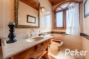 Casa em Condomínio à venda com 565m², 5 dormitórios, 3 suítes, 4 vagas, no bairro Cavalhada em Porto Alegre