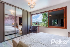 Casa em Condomínio à venda com 565m², 5 dormitórios, 3 suítes, 4 vagas, no bairro Cavalhada em Porto Alegre