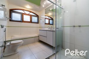 Casa em Condomínio à venda com 565m², 5 dormitórios, 3 suítes, 4 vagas, no bairro Cavalhada em Porto Alegre