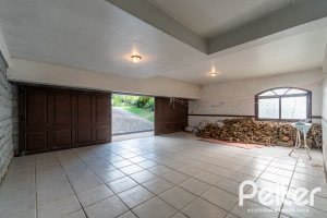 Casa em Condomínio à venda com 565m², 5 dormitórios, 3 suítes, 4 vagas, no bairro Cavalhada em Porto Alegre