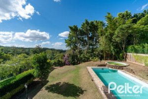 Casa em Condomínio à venda com 565m², 5 dormitórios, 3 suítes, 4 vagas, no bairro Cavalhada em Porto Alegre