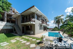 Casa em Condomínio à venda com 495m², 3 dormitórios, 1 suíte, 5 vagas, no bairro Nonoai em Porto Alegre