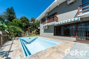 Casa em Condomínio à venda com 495m², 3 dormitórios, 1 suíte, 5 vagas, no bairro Nonoai em Porto Alegre