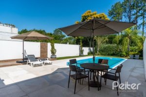 Casa em Condomínio à venda com 239m², 4 dormitórios, 4 suítes, 4 vagas, no bairro Terra Ville em Porto Alegre