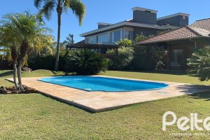 Casa em Condomínio à venda com 596m², 4 dormitórios, 4 suítes, 4 vagas, no bairro Terra Ville em PORTO ALEGRE