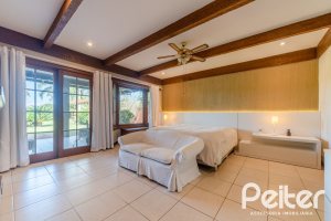 Casa em Condomínio à venda com 596m², 4 dormitórios, 4 suítes, 4 vagas, no bairro Terra Ville em PORTO ALEGRE