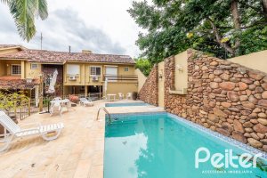 Casa em Condomínio à venda com 160m², 3 dormitórios, 1 suíte, 2 vagas, no bairro Tristeza em PORTO ALEGRE