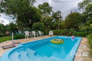 Casa em Condomínio à venda com 232m², 4 dormitórios, 1 suíte, 4 vagas, no bairro Terra Ville em PORTO ALEGRE