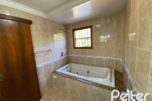 Casa à venda com 360m², 4 dormitórios, 4 suítes, 4 vagas, no bairro Tristeza em Porto Alegre