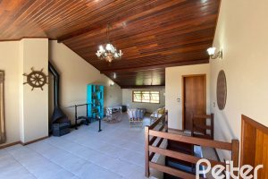 Casa à venda com 360m², 4 dormitórios, 4 suítes, 4 vagas, no bairro Tristeza em Porto Alegre