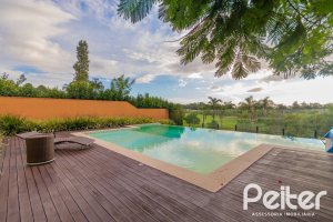 Casa em Condomínio à venda com 941m², 5 dormitórios, 5 suítes, 6 vagas, no bairro Terra Ville em PORTO ALEGRE