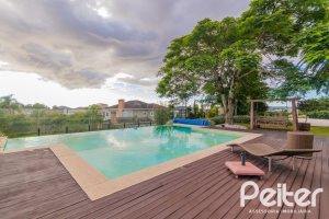 Casa em Condomínio à venda com 941m², 5 dormitórios, 5 suítes, 6 vagas, no bairro Terra Ville em PORTO ALEGRE