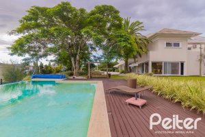 Casa em Condomínio à venda com 941m², 5 dormitórios, 5 suítes, 6 vagas, no bairro Terra Ville em PORTO ALEGRE