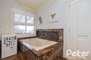 Casa em Condomínio à venda com 941m², 5 dormitórios, 5 suítes, 6 vagas, no bairro Terra Ville em PORTO ALEGRE