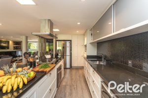 Casa em Condomínio à venda com 478m², 4 dormitórios, 4 suítes, 4 vagas, no bairro Terra Ville em PORTO ALEGRE