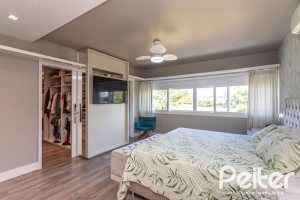 Casa em Condomínio à venda com 478m², 4 dormitórios, 4 suítes, 4 vagas, no bairro Terra Ville em PORTO ALEGRE