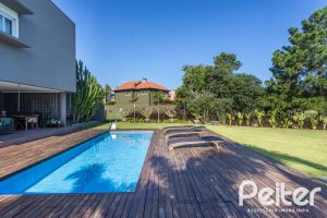 Casa em Condomínio à venda com 478m², 4 dormitórios, 4 suítes, 4 vagas, no bairro Terra Ville em PORTO ALEGRE