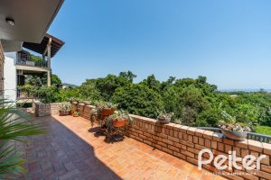 Casa em Condomínio à venda com 459m², 4 dormitórios, 4 suítes, 3 vagas, no bairro Cavalhada em PORTO ALEGRE