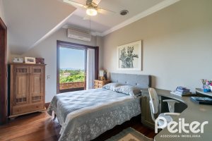 Casa em Condomínio à venda com 459m², 4 dormitórios, 4 suítes, 3 vagas, no bairro Cavalhada em PORTO ALEGRE