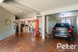 Casa em Condomínio à venda com 459m², 4 dormitórios, 4 suítes, 3 vagas, no bairro Cavalhada em PORTO ALEGRE