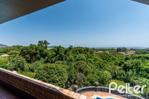 Casa em Condomínio à venda com 459m², 4 dormitórios, 4 suítes, 3 vagas, no bairro Cavalhada em PORTO ALEGRE