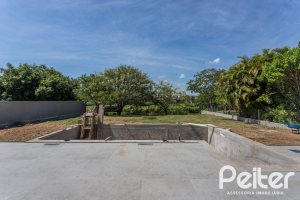 Casa em Condomínio à venda com 566m², 5 dormitórios, 5 suítes, 4 vagas, no bairro Terra Ville em PORTO ALEGRE