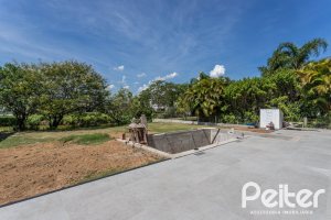 Casa em Condomínio à venda com 566m², 5 dormitórios, 5 suítes, 4 vagas, no bairro Terra Ville em PORTO ALEGRE