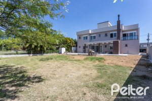 Casa em Condomínio à venda com 566m², 5 dormitórios, 5 suítes, 4 vagas, no bairro Terra Ville em PORTO ALEGRE