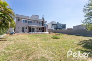 Casa em Condomínio à venda com 566m², 5 dormitórios, 5 suítes, 4 vagas, no bairro Terra Ville em PORTO ALEGRE