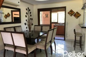 Casa em Condomínio à venda com 304m², 4 dormitórios, 1 suíte, 3 vagas, no bairro Vila Nova em Porto Alegre