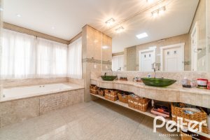 Casa em Condomínio à venda com 416m², 4 dormitórios, 4 suítes, 4 vagas, no bairro Terra Ville em PORTO ALEGRE