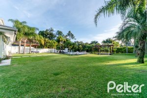 Casa em Condomínio à venda com 416m², 4 dormitórios, 4 suítes, 4 vagas, no bairro Terra Ville em PORTO ALEGRE