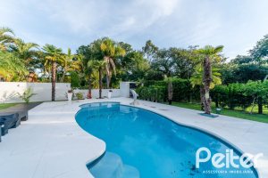 Casa em Condomínio à venda com 416m², 4 dormitórios, 4 suítes, 4 vagas, no bairro Terra Ville em PORTO ALEGRE