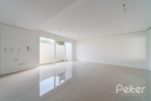 Casa em Condomínio à venda com 306m², 3 dormitórios, 3 suítes, 3 vagas, no bairro Vila Assunção em Porto Alegre