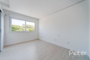 Casa em Condomínio à venda com 306m², 3 dormitórios, 3 suítes, 3 vagas, no bairro Vila Assunção em Porto Alegre