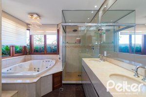 Casa em Condomínio à venda com 600m², 4 dormitórios, 4 suítes, 4 vagas, no bairro Terra Ville em PORTO ALEGRE