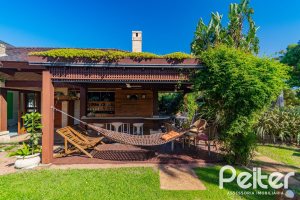 Casa em Condomínio à venda com 600m², 4 dormitórios, 4 suítes, 4 vagas, no bairro Terra Ville em PORTO ALEGRE