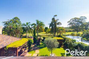 Casa em Condomínio à venda com 600m², 4 dormitórios, 4 suítes, 4 vagas, no bairro Terra Ville em PORTO ALEGRE