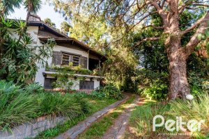 Casa à venda com 350m², 4 dormitórios, 4 suítes, 4 vagas, no bairro Tristeza em Porto Alegre